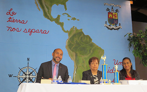 With Spanish dictionaries before them, and as much anticipation as the student competitors, judges Christian Garcia, Lourdes Perez and Jenny De La Cruz wait for the start of the oral portion of the Spanish Spelling Bee.