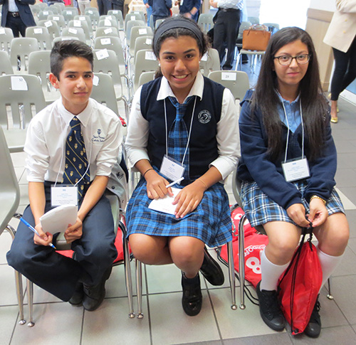 After a long afternoon of spelling, three Spanish spelling champs were crowned: (left to right) Jaime Diez, third place, St. Theresa School; Emily Diaz, second place, Mother of Christ School; Ashley Zelaya, first place, Sts. Peter and Paul.