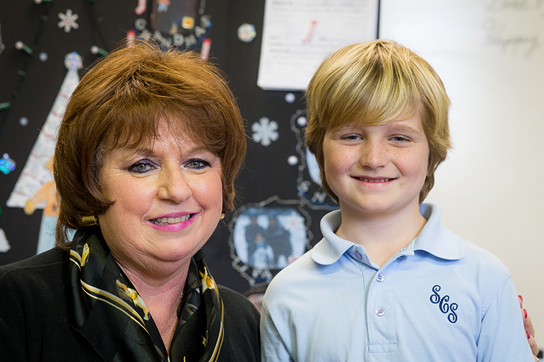 Kathleen Squilla, STARS Instructor at St. Coleman School, poses with second grader Ryan Walsh, who received an acknowledgment from the Vatican after mailing his "Flat Stanley" school project to Pope Francis at the end of last year. One of the project requirements was that students mail out the paper character to various locations for a visit and then have it mailed back to the school. The return package included prayer cards and a letter from U.S. Msgr. Peter B. Wells, assessor for general affairs at the Vatican.
