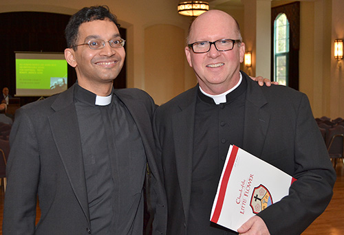 Father Earl Fernandes, dean of the Athenaeum of Ohio, Cincinnati, poses with Father Michael Davis, pastor of Little Flower Parish in Coral Gables, who came up with the idea for the symposium on death, dying and Catholic funeral rites.