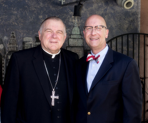 Archbishop Thomas Wenski poses with Matt Callihan at the Anthony's Runway 84 Cheers to Charity event.