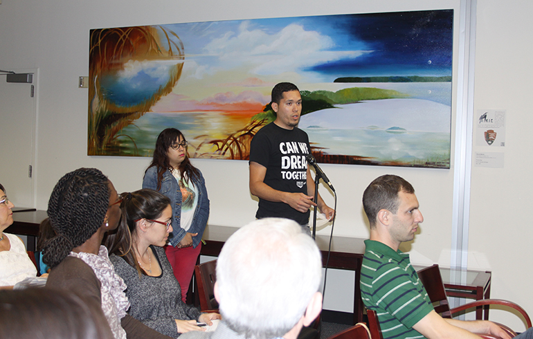 Julio Calderon, an immigration activist and undocumented student at FIU, asks about the situation of unaccompanied minors who are crossing the Texas border into the U.S. - since he was one of them - during the panel discussion on immigration reform hosted by the university.