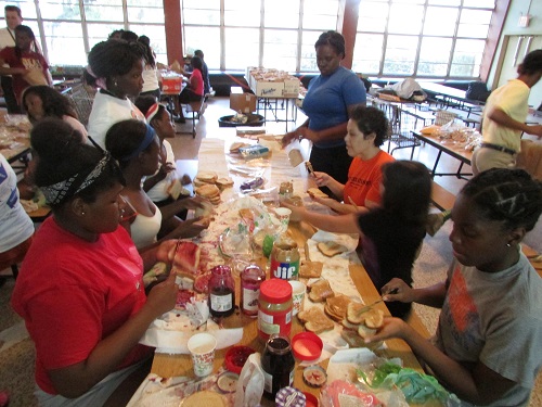 Archbishop Curley Notre Dame students prepare lunches for Miami's poor during their 19th annual HungerFest.