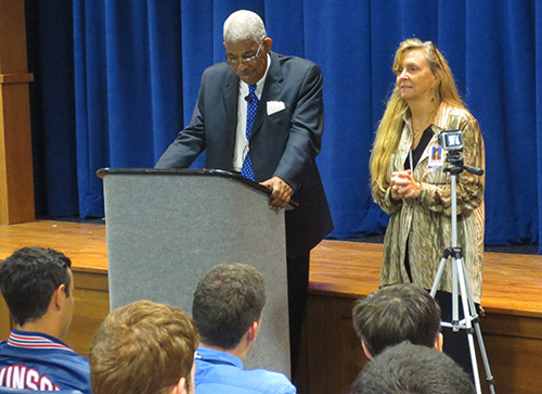 Christopher Columbus High School history and government teacher Mary McCullagh introduces Freedom Rider Rip Patton. McCullagh had met Patton at a conference and invited him to speak at Columbus High.