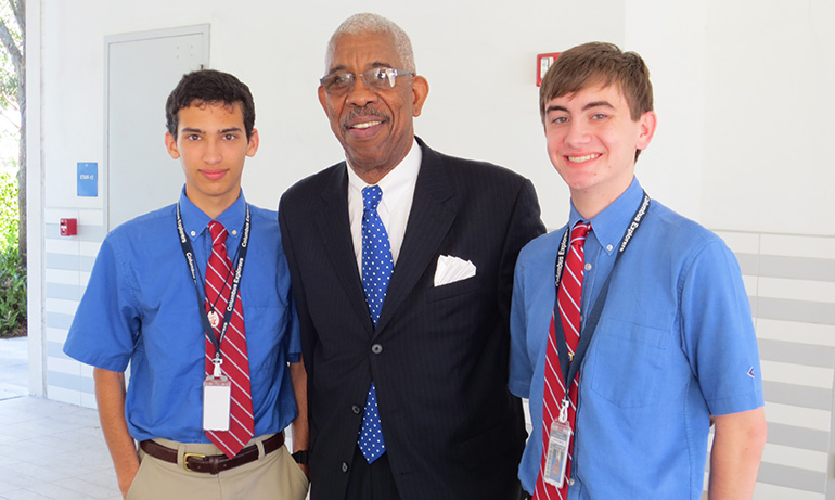 Senior Andrew Forero (left) and Andres Gomez (right), members of Rho Kappa Social Studies Honor Society, take a photo with Freedom Rider Rip Patton. Patton was invited to Christopher Columbus High School to speak about his actions as a civil rights activist and Freedom Rider during the 1960s.
