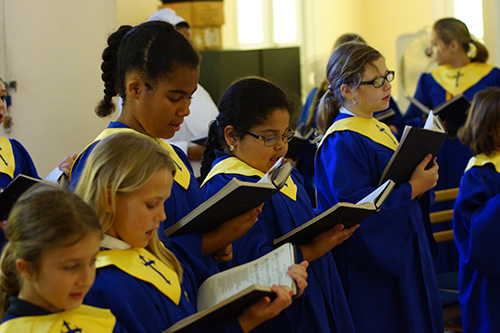 Children from the Basilica of St. Mary Star of the Sea School sing during the Red Mass.