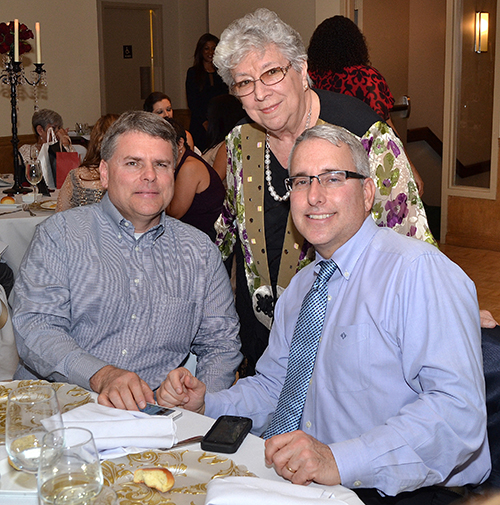 Sister Vivian Gomez, principal of St. Jerome School, with Robert Childs, left, and Dr. Richard Childs.