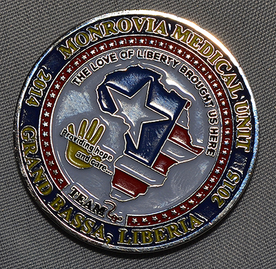 Close-up of the commemorative coin presented to Sister Vivian Gomez by Dr. Richard Childs.