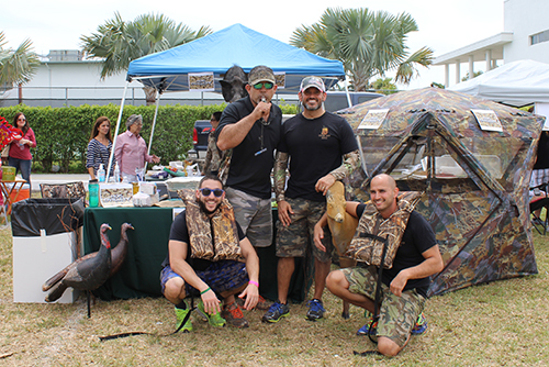One of the pig-roasting teams consisted of St. Brendan faculty members, from left, Kevin Esteban, Ray Del Toro, Carlos Nunez, and JP Arrastia.