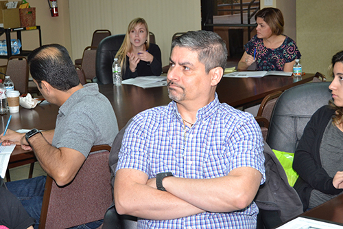 Javier Cardone, center, listens during a Virtus workshop.