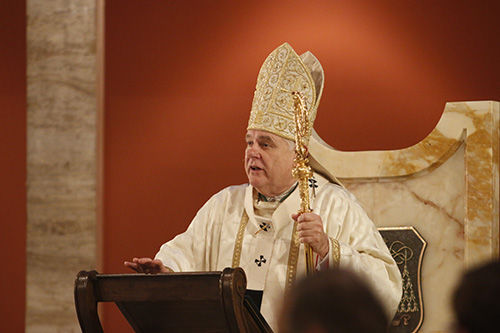 Archbishop Thomas Wenski preaches the homily during the chrism Mass.