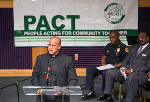 Father Christopher Marino, St. Mary Cathedral's rector, addresses PACT members at the Nehemiah Action Assembly.