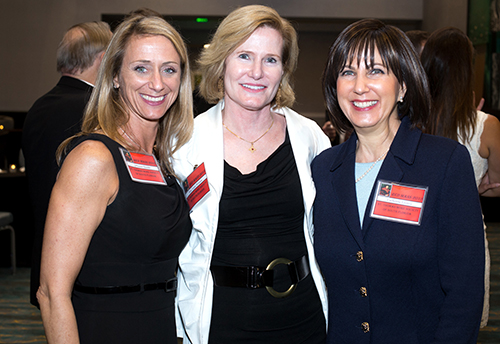 Johanna Saxton Shields, left, poses with Judge Laura Watson and  Catherine Favitta, members of the St. Thomas More Society in South Florida, following the annual Red Mass April 23 at St. Anthony Church in Fort Lauderdale.