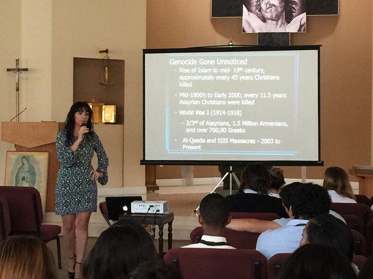 Juliana Taimoorazy, founder and president of the Iraqi Christian Relief Council, speaks to students from Msgr. Edward Pace High School inside the school's chapel on April 21.