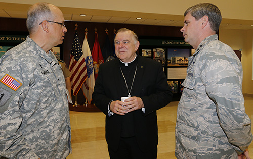 Archbishop Thomas Wenski speaks with U.S. Southern Command Chaplain Col. Michael Lembke, left, and Maj. Gen. Michael Plehn, chief of staff, after arriving at SouthCom headquarters in Doral for the Religion Matters II conference.