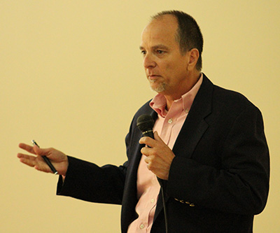 James Carballo, project manager at the archdiocesan Building and Property Office, discusses maintenance fundamentals at the Earth Day Facility Management Training Seminar. "Even the lightbulbs are important," Carballo said.