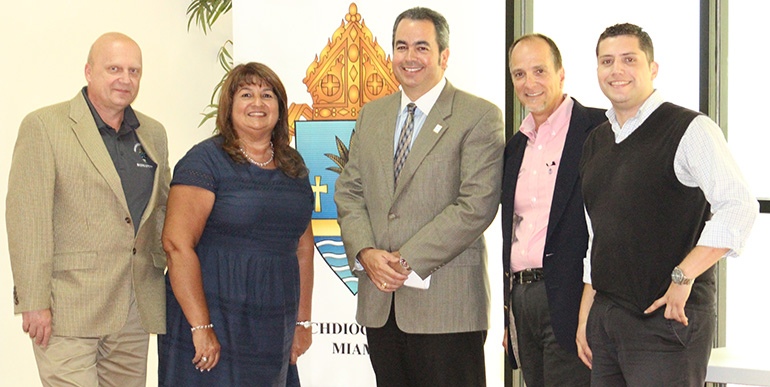 The Building and Property Office team that helps build and maintain archdiocesan churches and schools consists of, from left: Pawel Kobrzynski, assistant building and project manager, Janet Rancaño, office coordinator, David Prada, senior director, James Carballo, project manager, and Alfonso Balmaceda, administrative assistant and data clerk.