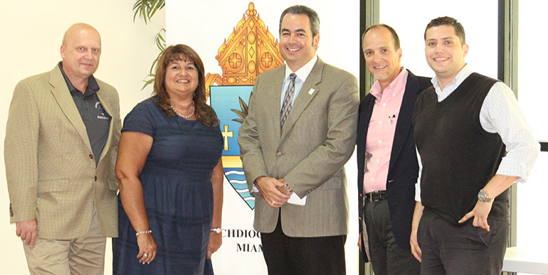 The Building and Property Office team that helps build and maintain archdiocesan churches and schools consists of, from left: Pawel Kobrzynski, assistant building and project manager, Janet Rancaño, office coordinator, David Prada, senior director, James Carballo, project manager, and Alfonso Balmaceda, administrative assistant and data clerk.