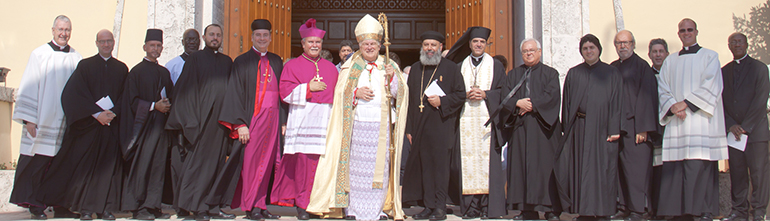 Clergy from the Archdiocese of Miami and from various Eastern-rite and Orthodox churches pose for a photo after participating in the prayer vigil for peace in the Middle East at St. Mary Cathedral.