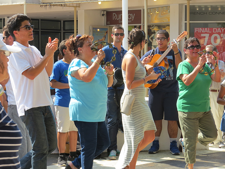 Members of the Neocatechumenal Way sing and dance on Lincoln Road, Miami Beach. The street missions are lively affairs aimed at attracting youths and combating the misconception that Church is for an older crowd
