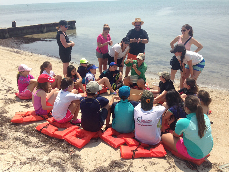 Sitting by the seashore, St. Brendan Elementary students learned about the need to preserve the ocean's seagrass beds.