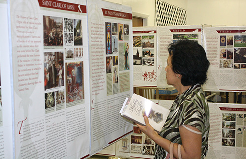 A visitor looks over the "Miracles of the Eucharist" exhibit which was on display at St. Boniface in Pembroke Pines for over a week in mid-April.