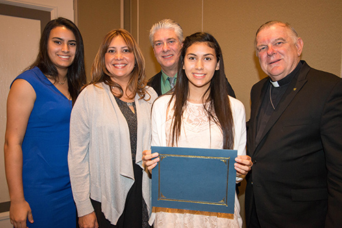 Archbishop Thomas Wenski poses with $ 5,000 scholarship recipient Vanessa Perez-Robles, of Our Lady of the Lakes School in Miami Lakes, and her family, from left: Sister Gabriela, mom Yibis Perez-Robles and dad Robert Hochfelder.