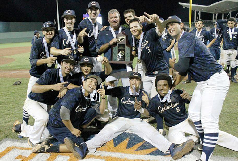 Members of Christopher Columbus High's baseball team celebrate their state championship win after the game.