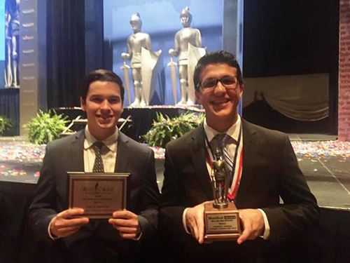 Christopher Columbus High School's Joseph Corderi, right, 2015 Silver Knight winner in business, poses with Tyler Anderson, who received an honorable mention for speech, after the awards ceremony May 20.