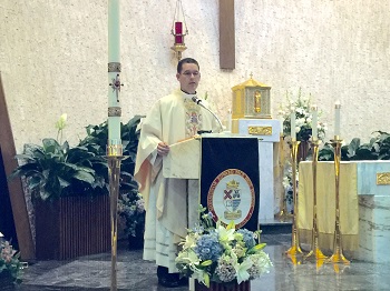 Father Bryan Garcia, a Msgr. Pace High class of 2006 alumnus, preaches the homily at the Baccalaureate Mass held for Msgr. Pace High's class of 2015. The Mass was celebrated May 17 at Immaculate Conception Church in Hialeah.