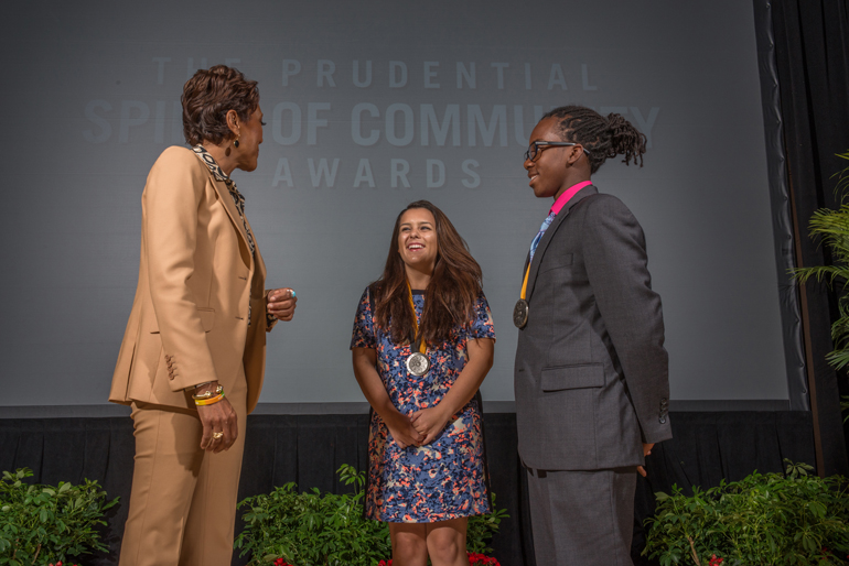 Carolina Gonzalez, center, a senior at Our Lady of Lourdes Academy, meets "Good Morning America" co-anchor Robin Roberts, left, at a dinner reception for all state honorees, which took place at the Smithsonian's National Museum of Natural History May 4.