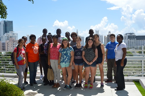 At the end of the tour, the ACND Summer Knights students spent some time enjoying the rooftop view of the New World Center on Miami Beach. Front row, from left: Esperanza Cadena, teacher Daphne Dominique, Chelsey Pierre, Virginia Hayward, Kanti Gudur, Mariah Perez, Erica Wilder, Melanie Perez, Audrey Romanik, and teacher Novelette Lindsay. Back row, from left: Brianna Gaspard, Styve Mbuyi, Clermondo Erisme, Hedwyn Lamy, Ronald Rodriguez, Branden Dominique and Bishop Vidal.