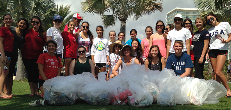 The beach clean-up group led by Cardinal Gibbons HIgh School students Juliette Selmeci and Tristan Hutchison pose with their "catch."