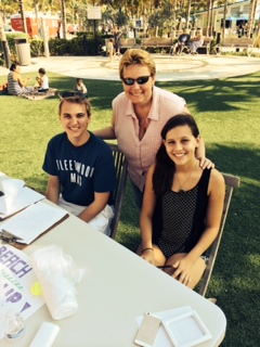 Cardinal Gibbons students Tristan Hutchison and Juliette Selmeci, seated, pose with Dawn Bosaller of Fort Lauderdale's Youth Leadership Development Program.