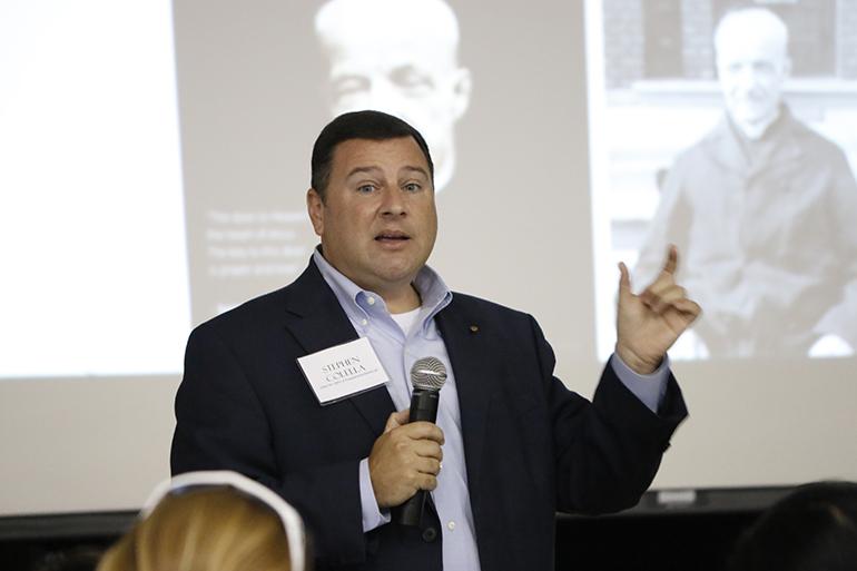 Stephen Colella, cabinet secretary for Parish Life, speaks to parish staff about a "gatekeeper" who became a saint: André Bessette of Montreal.