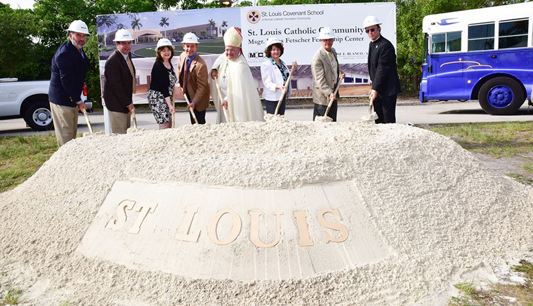 Doing the traditional shovel-turning for a groundbreaking, second from left: David Prada, archdiocesan director of the Office of Building and Property; Pinecrest councilmember, Cheri Ball; St. Louis Covenant School principal, Edward Garcia; Auxiliary Bishop Peter Baldacchino; Pinecrest Mayor, Cindy Lerner; Pinecrest councilmember, James E. McDonald and Father Paul Vuturo, pastor.