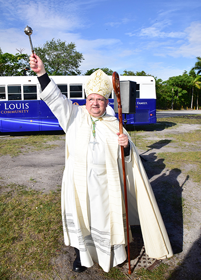 Auxiliary Bishop Peter Baldacchino blesses the ground where the Monsignor James Fetscher Fellowship Center will be built.