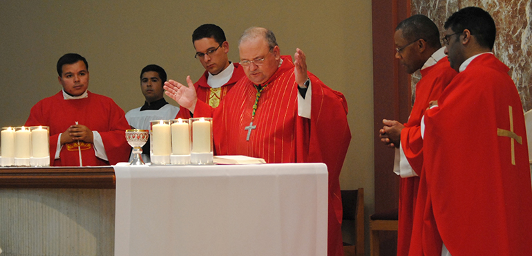 Bishop Peter Baldacchino celebrates Mass for the first Archdiocesan young adult event at St. Kieran Church. With him are from left to right: Father Elvis Gonzalez, Vocations director at St. Mary Cathedral; newly-ordained Father Bryan Garcia, Parochial Vicar at St. Andrew; Father Biju Vells, Parochial Vicar at St. Andrew; and Father J. Sterling Laurent, priest in residence at St. Kieran.