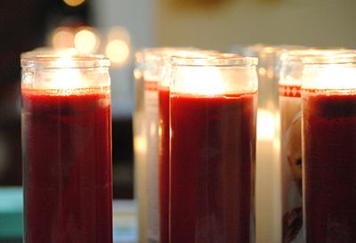 Candles are lighted to symbolize the light that young adults are called to be at the first archdiocesan Young Adult Ministry event.