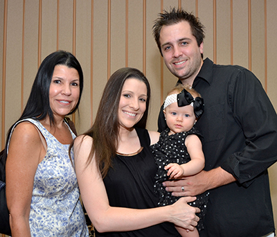 Among the families attending the reception for Sister Vivian were, from left, Julie Castro, her daughter Alexis Wells and Alexis' husband Jeff Wells, and their 9-month-old daughter Makenzie.