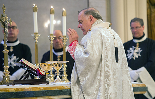 Archbishop Thomas Wenski celebrates a special Mass with members of the Cuban Association of the Order of Malta.