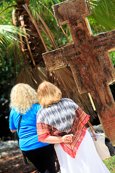 Participants Linda Gross and Elaine Parker of St. Maximilian Kolbe Parish in Pembroke Pines, explore the prayer garden at St. Pablo Parish in Marathon following prayers and reflection June 27 during the Fortnight for Freedom pilgrimage to the five Catholic parishes of the Florida Keys.