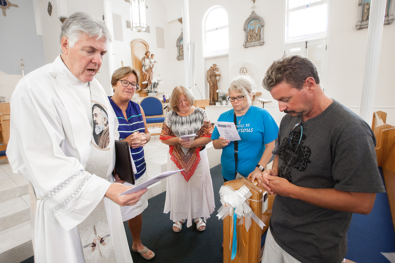Participants in the June 27 Fortnight for Freedom pilgrimage to the five Catholic parishes of the Florida Keys pray at the Basilica of St. Mary Star of the Sea in Key West at the conclusion of the one-day event.