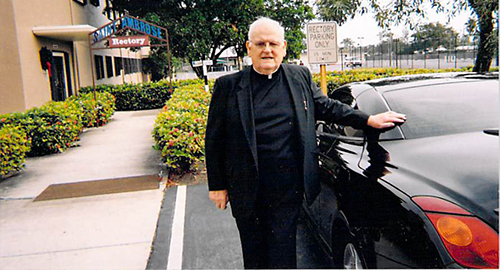 Father James Connaughton is shown here outside the rectory of St. Ambrose Church in Deerfield Beach, where he served as pastor for 25 years. Born Dec. 15, 1924, he was ordained a priest in June 1950 and retired from active ministry in June 1993. He died July 19, 2015, after being in failing health for about a decade.
