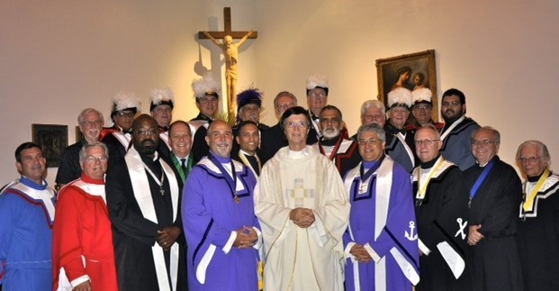Officers with St. Louis Parish's Knights of Columbus Council 14730 pose with their pastor, Father Paul Vuturo, after a recent event at the church. The council just won a national award for recruiting new members.