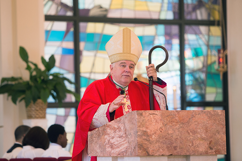 Archbishop Thomas Wenski addresses students and faculty in his homily at the opening of school Mass for Archbishop Curley Notre Dame Prep. The Mass was celebrated Aug. 28 at Notre Dame d'Haiti Church in Miami.