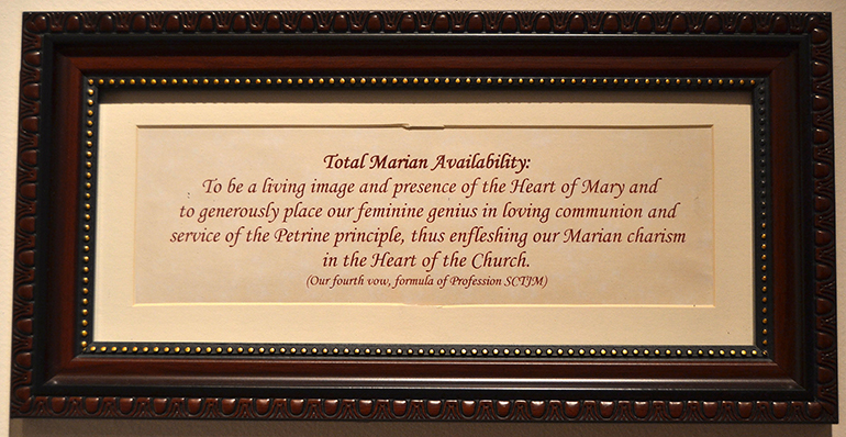 Fourth vow of the Servants of the Pierced Hearts of Jesus and Mary hangs on the convent wall.