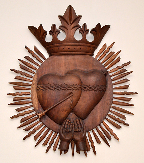 Another symbol of the order depicts the pierced hearts of Jesus and Mary.