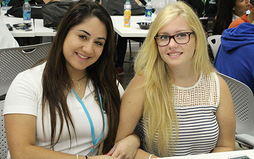 American and Italian fusion: Kaylee Suarez (left) a junior at Archbishop McCarthy High catches up with Martina Anselmo  who was visiting from Palermo, Sicily, Italy as part of a cultural exchange program. Martina and 19 of her classmates will be staying with McCarthy High student hosts and their families for two weeks.