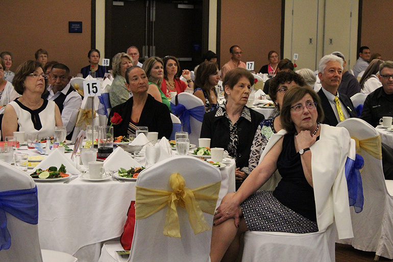 Before lunch was served, supporters of the Respect Life Ministry listen intently to Joan Crown, director of the Respect Life Ministry.